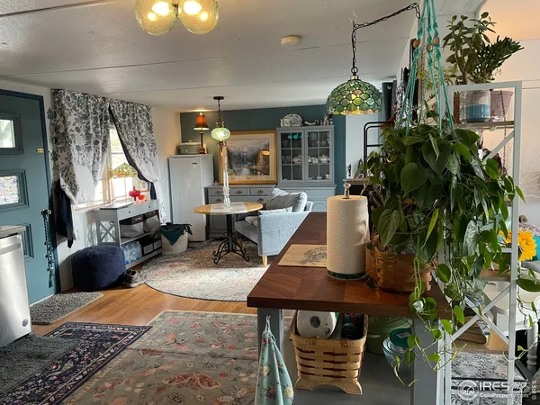 a view of a entryway door with wooden floor