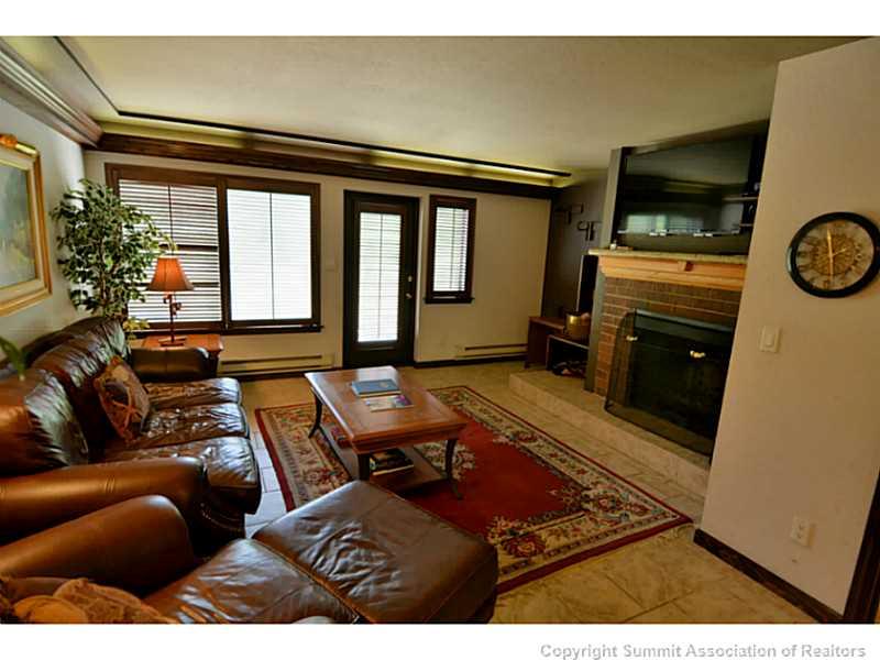 1944 Soda Ridge Road Keystone, CO 80435 - Photo 22 of 25 a living room with furniture and a flat screen tv
