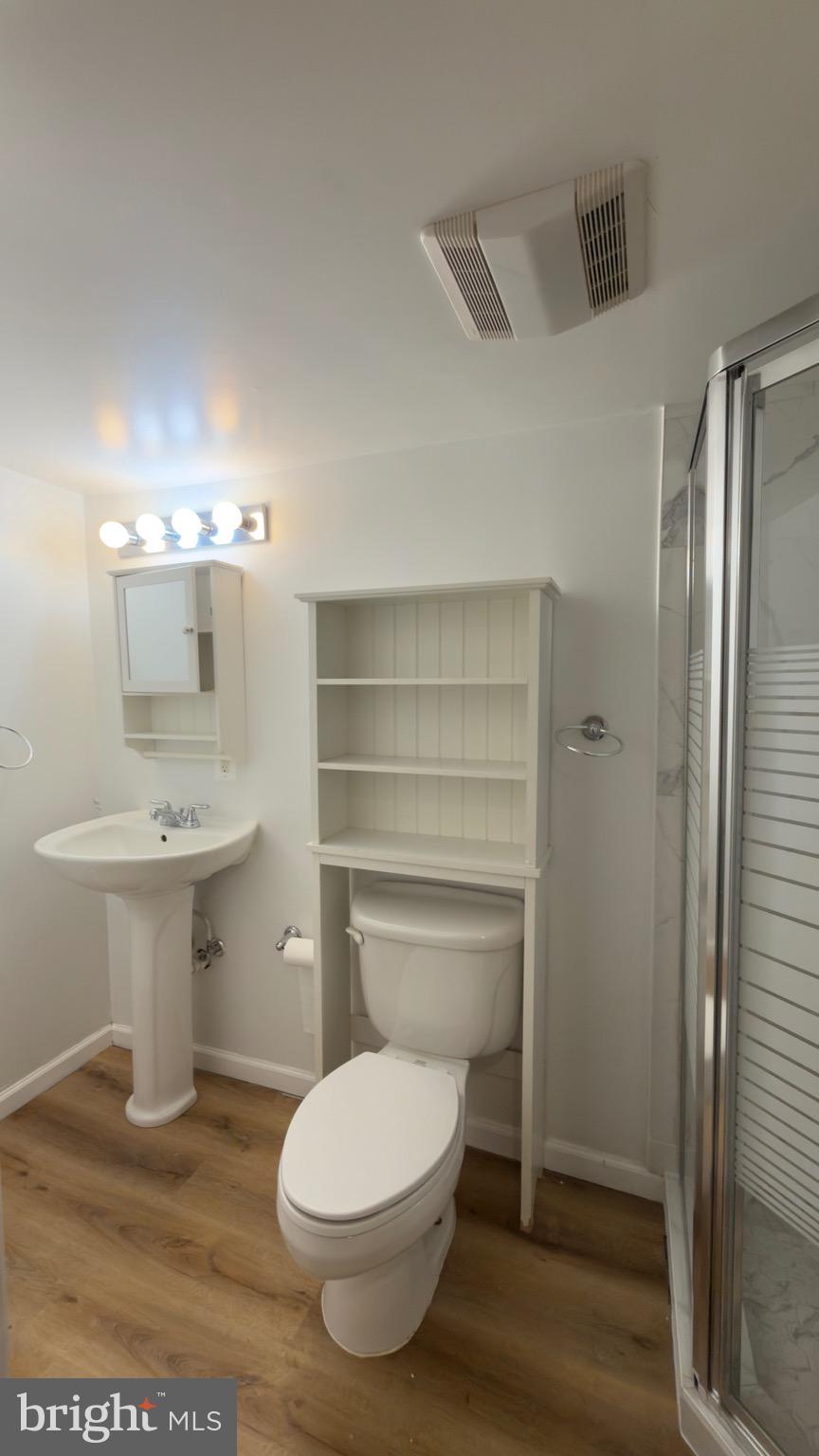 1117 7th Street Northeast Washington, DC 20002 - Photo 6 of 11 a bathroom with a sink toilet and shower