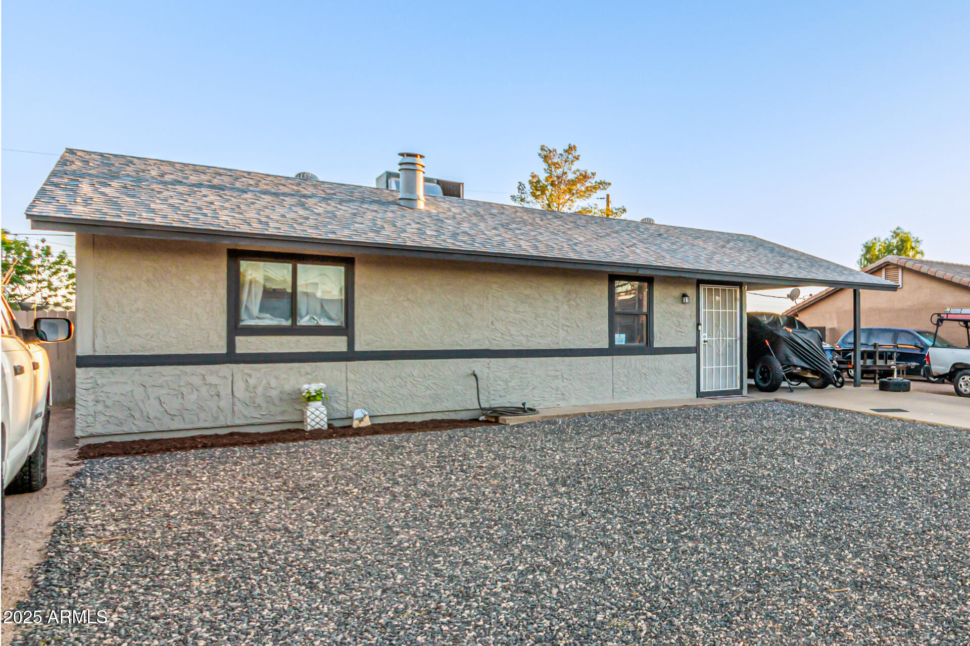 677 West 22nd Avenue Apache Junction, AZ 85120 - Photo 12 of 21 a front view of a house with garden