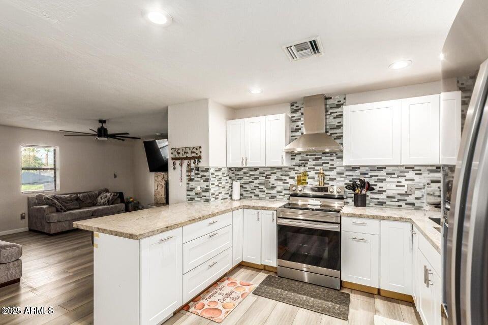 677 West 22nd Avenue Apache Junction, AZ 85120 - Photo 17 of 21 a kitchen with a stove sink and cabinets