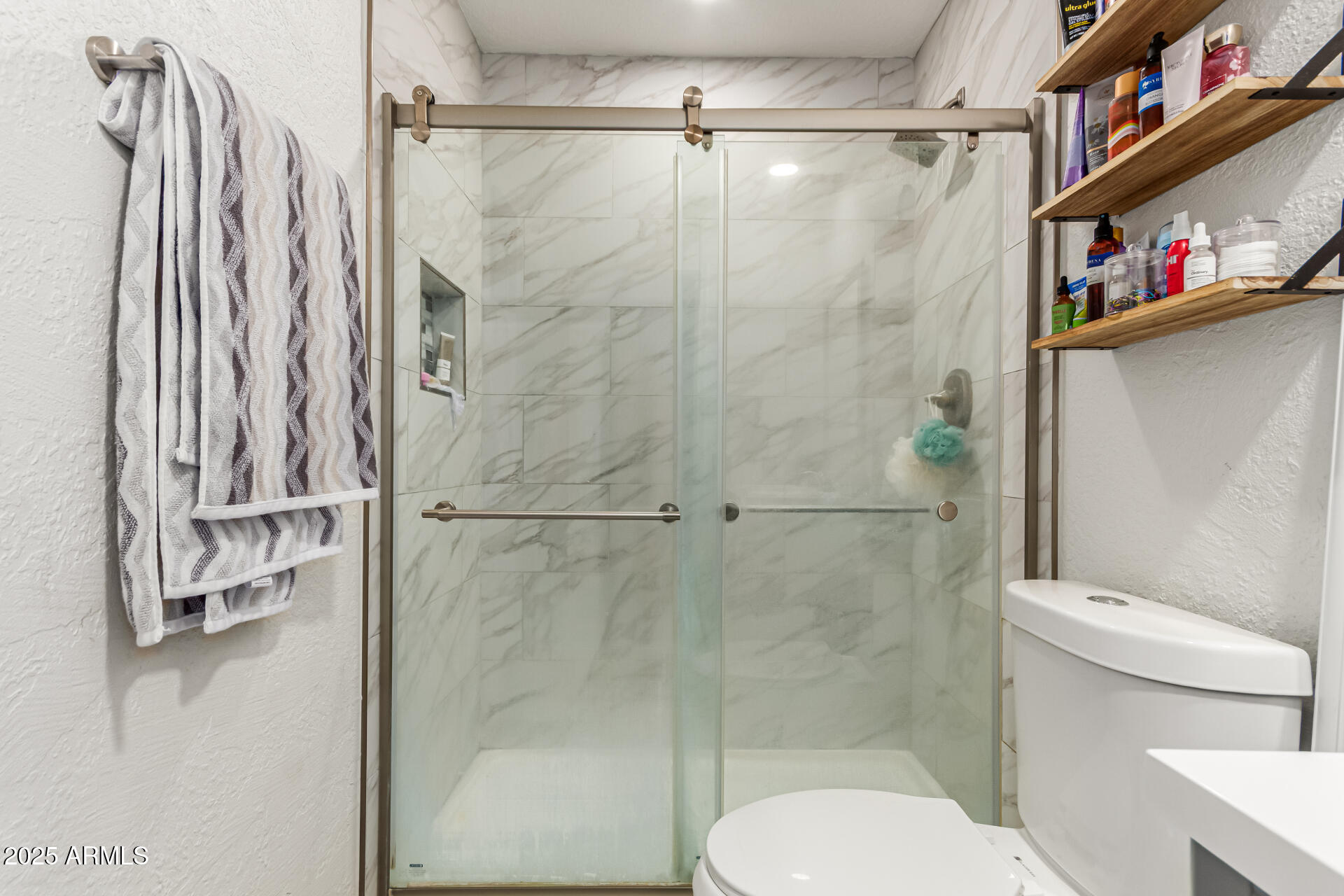 677 West 22nd Avenue Apache Junction, AZ 85120 - Photo 19 of 21 a bathroom with a shower a toilet and a shower