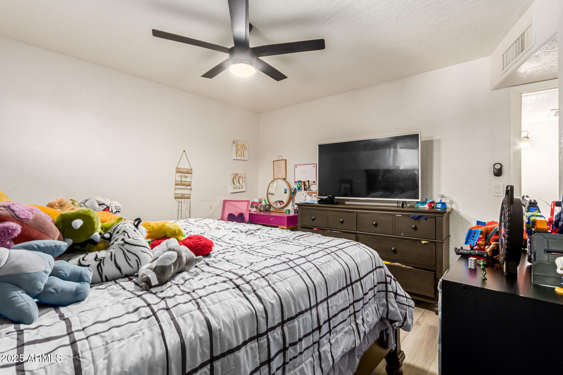 677 West 22nd Avenue Apache Junction, AZ 85120 - Photo 20 of 21 a bedroom with a bed and a flat screen tv