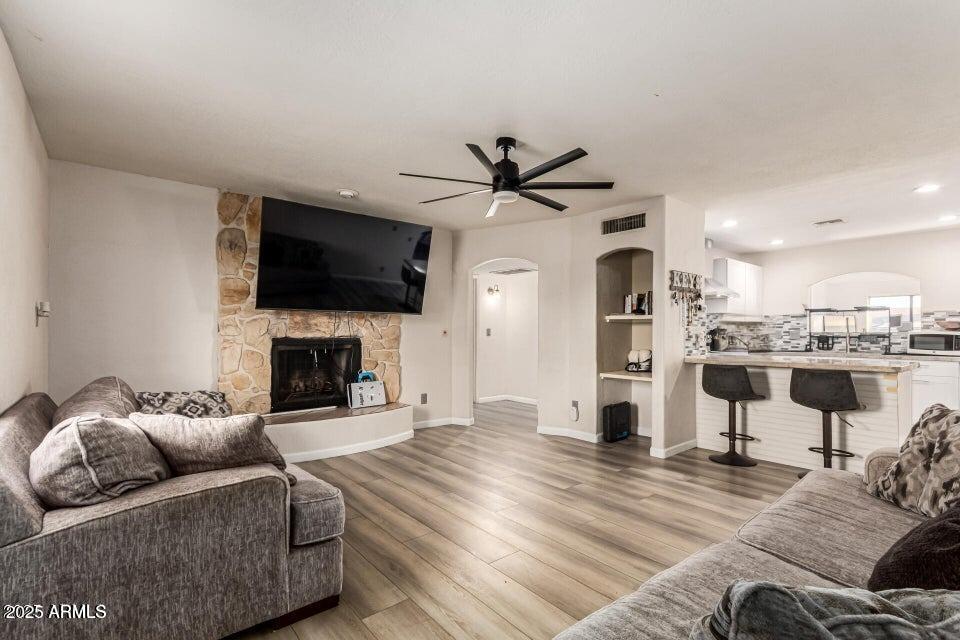 677 West 22nd Avenue Apache Junction, AZ 85120 - Photo 3 of 21 a living room with furniture fireplace and flat screen tv