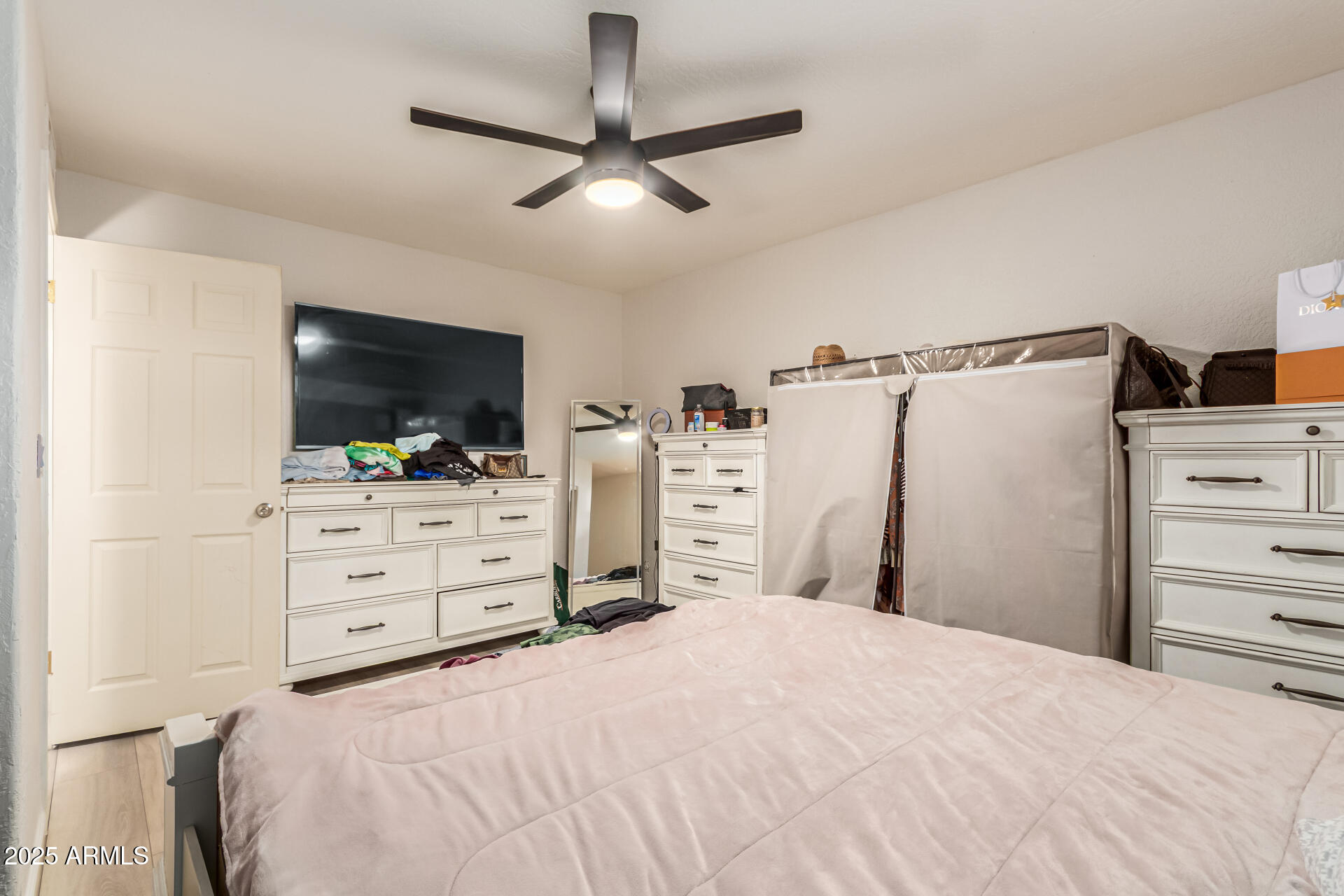 677 West 22nd Avenue Apache Junction, AZ 85120 - Photo 4 of 21 a bedroom with a bed and flat screen tv