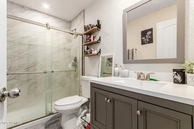 a bedroom with a bed and dresser