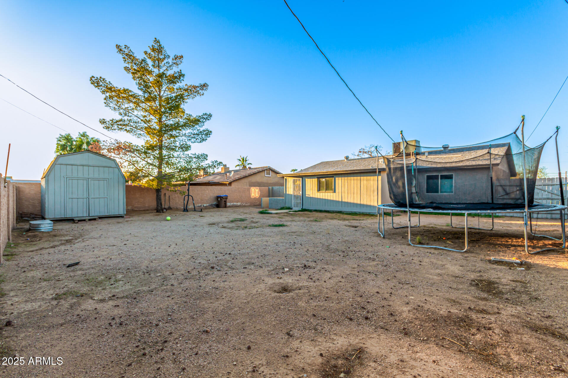677 West 22nd Avenue Apache Junction, AZ 85120 - Photo 10 of 21 a view of a house with a backyard and a patio