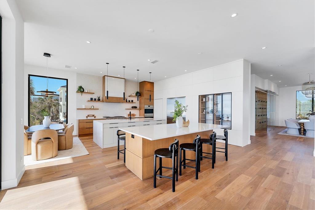 4005 Casey Key Road Nokomis, FL 34275 - Photo 11 of 84 a open dining room with stainless steel appliances a table and chairs
