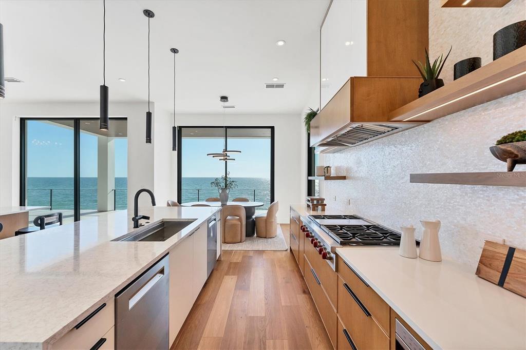 4005 Casey Key Road Nokomis, FL 34275 - Photo 14 of 84 a kitchen with granite countertop a sink a counter space appliances and cabinets