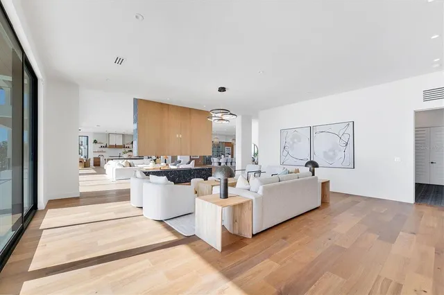 a bathroom with a tub a toilet a sink and glass door