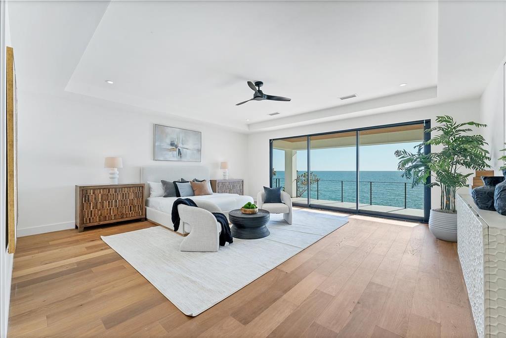 4005 Casey Key Road Nokomis, FL 34275 - Photo 24 of 84 a living room with furniture large window and wooden floor