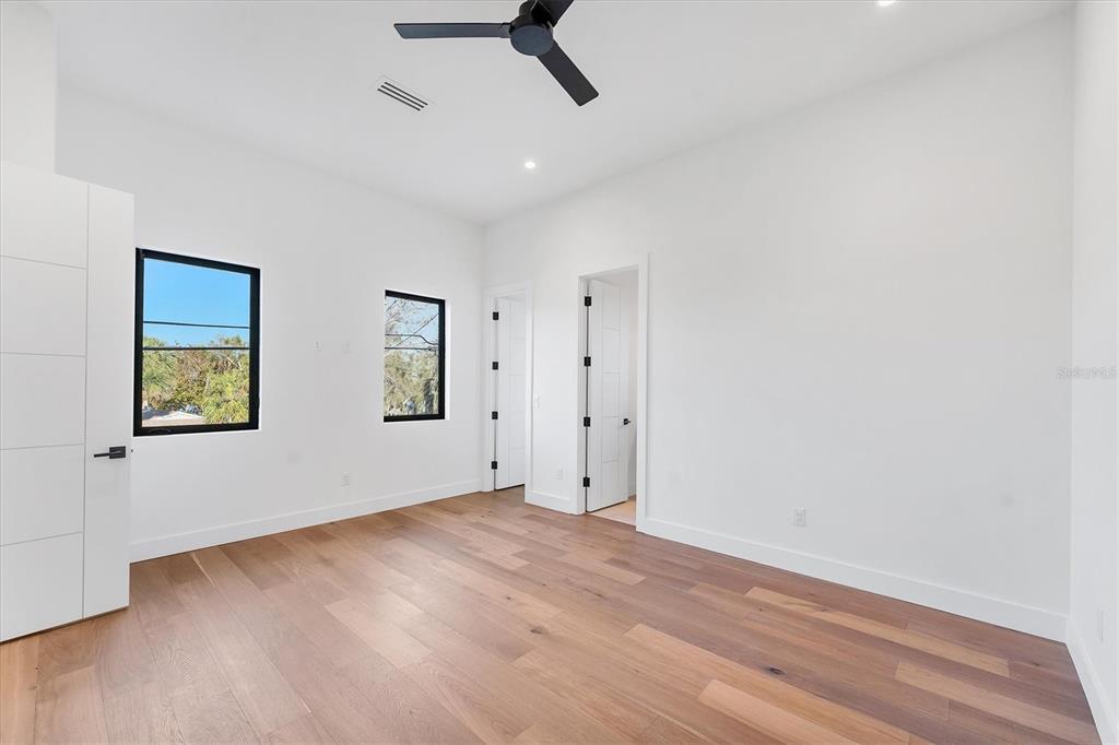 4005 Casey Key Road Nokomis, FL 34275 - Photo 35 of 84 wooden floor in an empty room with a window