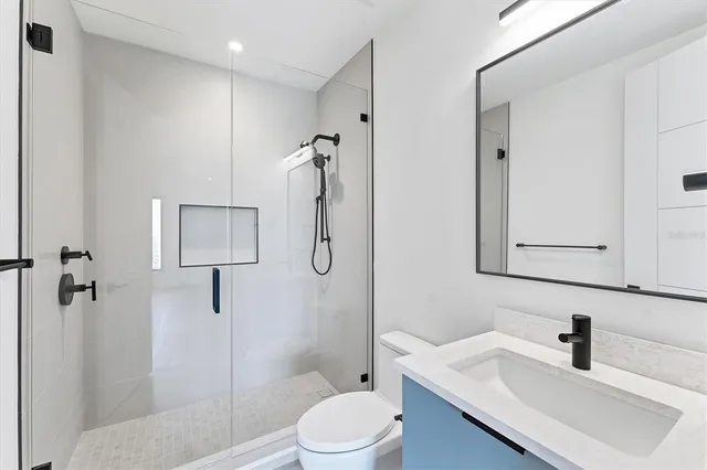 an aerial view of a house with a ocean view