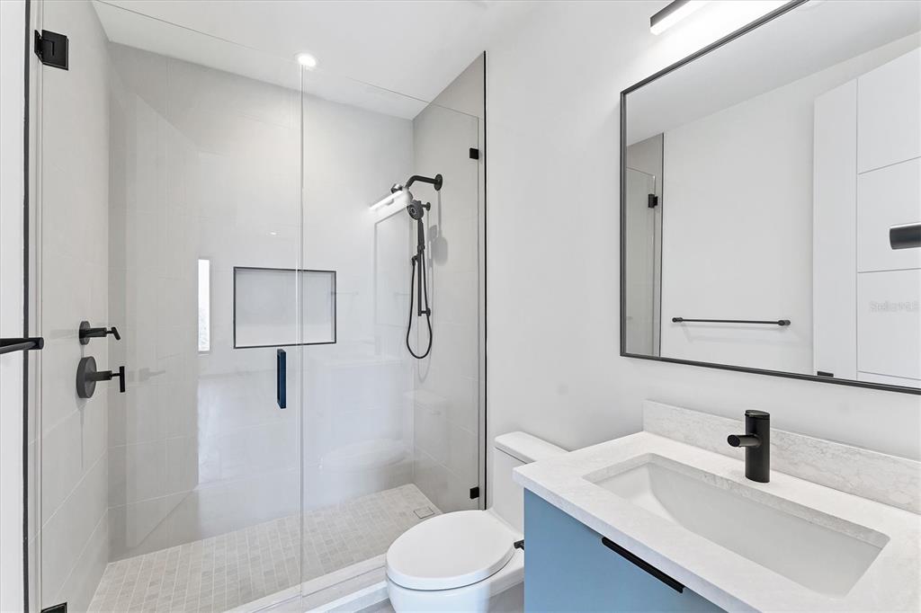 4005 Casey Key Road Nokomis, FL 34275 - Photo 40 of 84 a bathroom with a sink toilet and shower