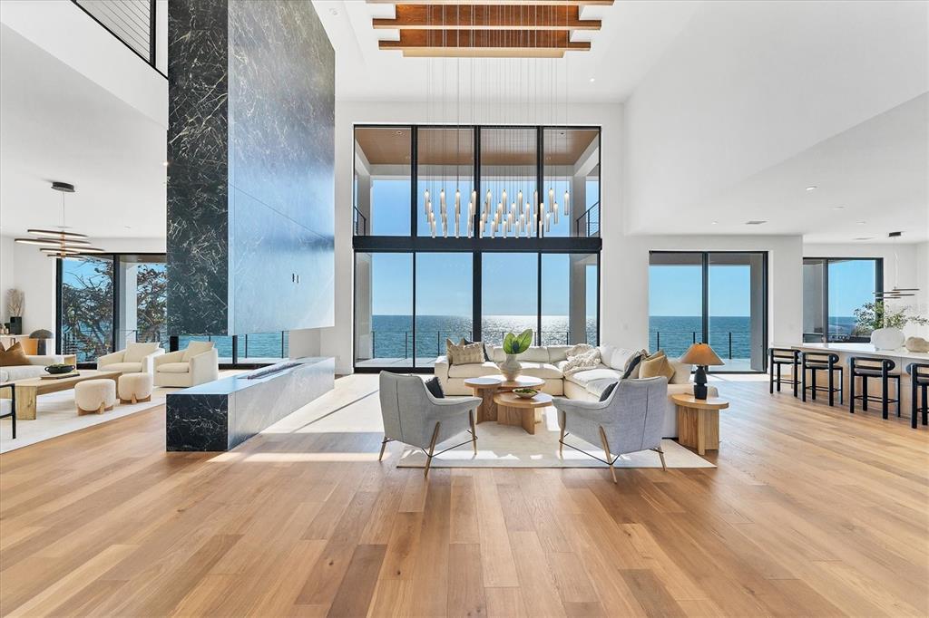 4005 Casey Key Road Nokomis, FL 34275 - Photo 4 of 84 a living room with furniture and large windows