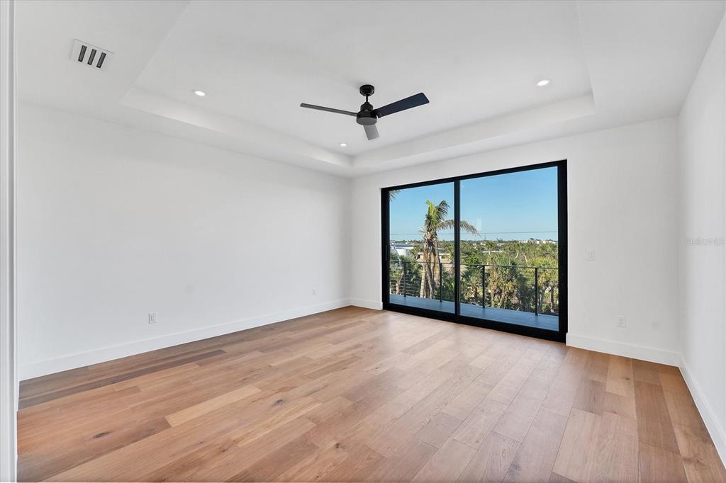 4005 Casey Key Road Nokomis, FL 34275 - Photo 48 of 84 wooden floor in an empty room with a window