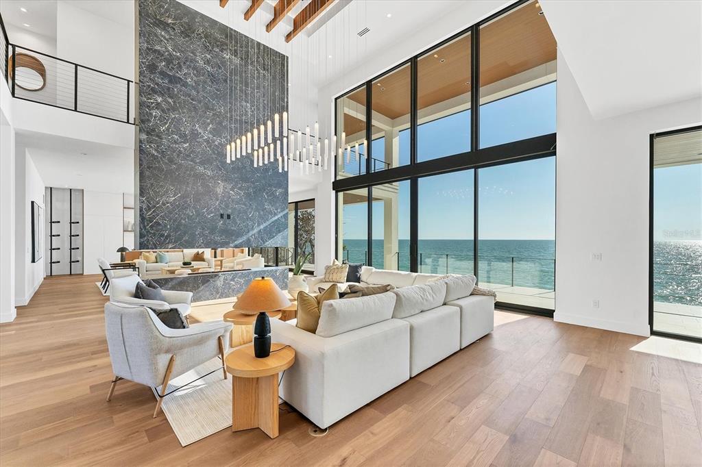 4005 Casey Key Road Nokomis, FL 34275 - Photo 6 of 84 a living room with furniture fireplace and floor to ceiling windows