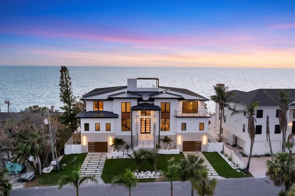 4005 Casey Key Road Nokomis, FL 34275 - Photo 66 of 84 a front view of a house with a yard