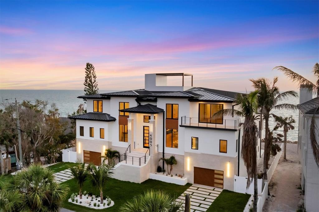 4005 Casey Key Road Nokomis, FL 34275 - Photo 67 of 84 a front view of a house with a yard