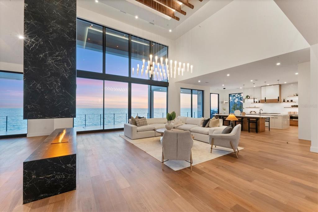 4005 Casey Key Road Nokomis, FL 34275 - Photo 69 of 84 a living room with fireplace furniture and a large window