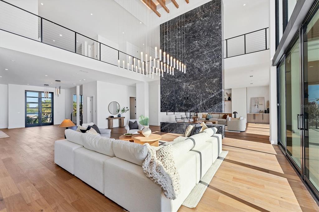 4005 Casey Key Road Nokomis, FL 34275 - Photo 8 of 84 a living room with furniture fireplace and a rug