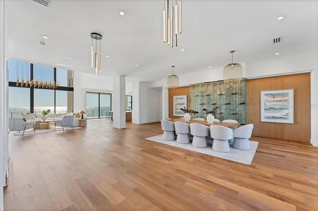 a kitchen with stainless steel appliances granite countertop sink stove and wooden floor