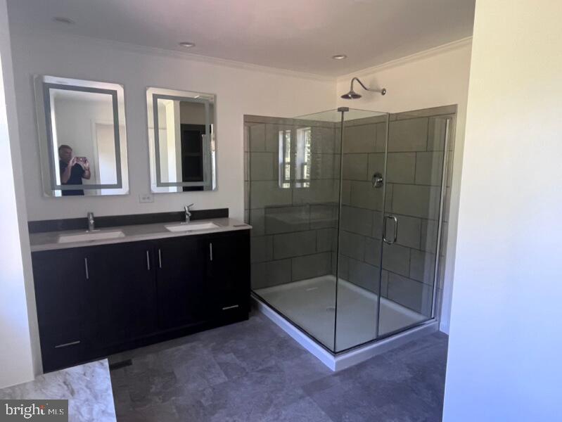 136 Minch Road Parkesburg, PA 19365 - Photo 14 of 17 a bathroom with a shower a mirror and a sink