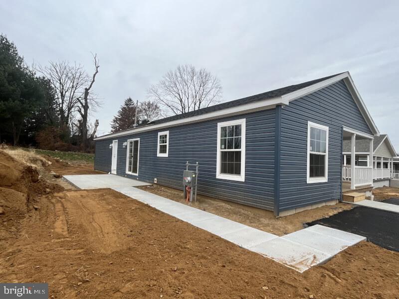 136 Minch Road Parkesburg, PA 19365 - Photo 3 of 17 a front view of a house with yard