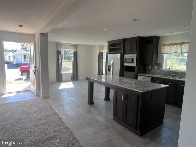 136 Minch Road Parkesburg, PA 19365 - Photo 6 of 17 a kitchen with stainless steel appliances granite countertop a stove and refrigerator