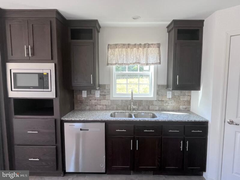 136 Minch Road Parkesburg, PA 19365 - Photo 7 of 17 a bathroom with a granite countertop sink a mirror and cabinets
