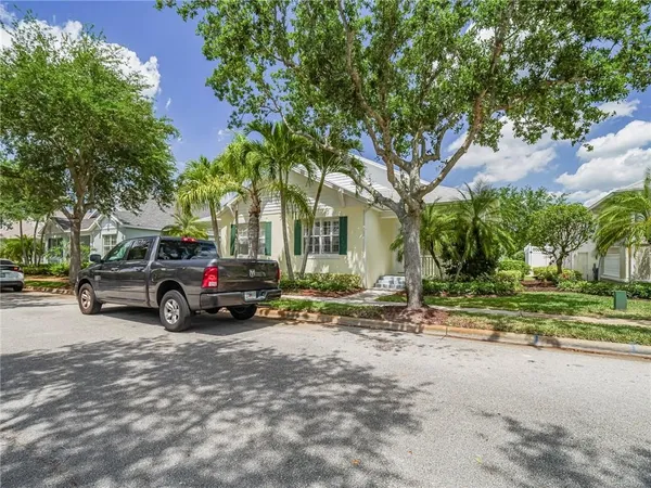 a view of a house with a truck parked in front of a house