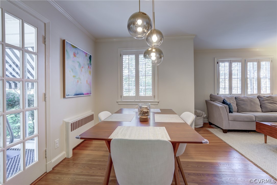 8505 Julian Road Henrico, VA 23229 - Photo 11 of 44 a view of a dining room with furniture a chandelier and wooden floor