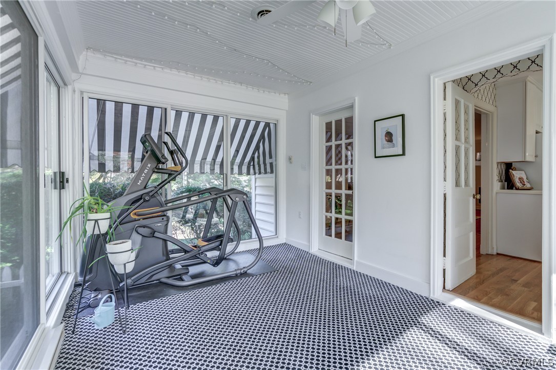8505 Julian Road Henrico, VA 23229 - Photo 14 of 44 a view of a hallway with wooden floor and a chandelier