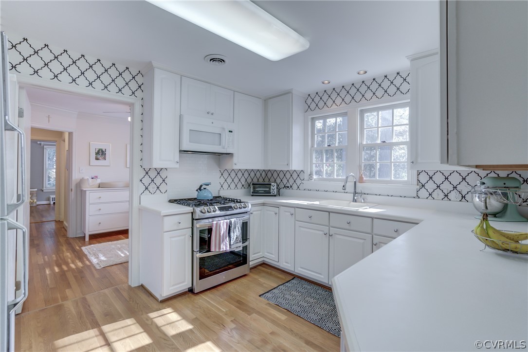 8505 Julian Road Henrico, VA 23229 - Photo 15 of 44 a kitchen with stainless steel appliances granite countertop a stove a sink and a refrigerator