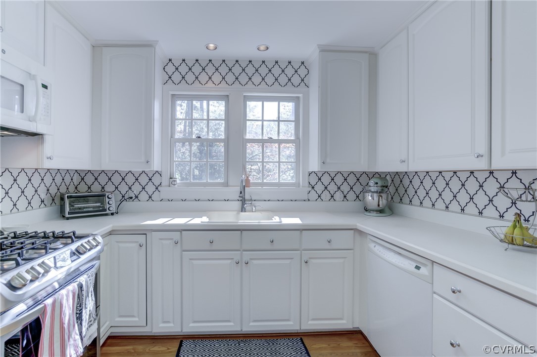 8505 Julian Road Henrico, VA 23229 - Photo 16 of 44 a kitchen with stainless steel appliances granite countertop a sink stove and cabinets
