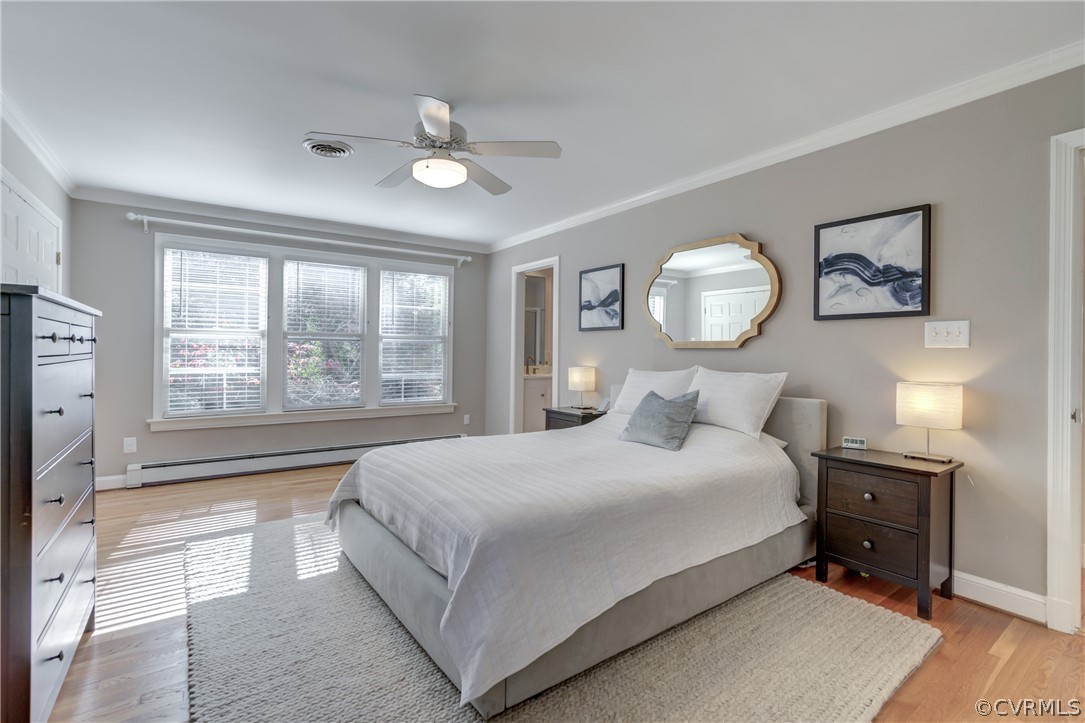 8505 Julian Road Henrico, VA 23229 - Photo 27 of 44 a bedroom with a large bed and a chandelier