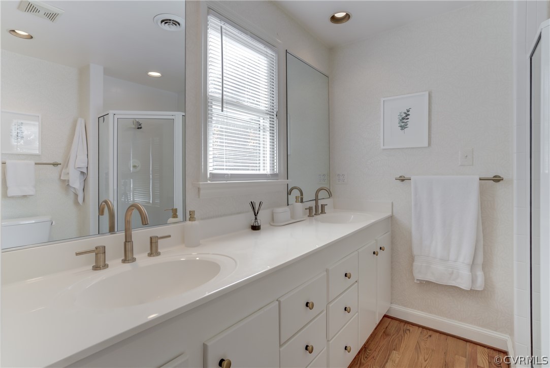8505 Julian Road Henrico, VA 23229 - Photo 29 of 44 a bathroom with double vanity sink a mirror and a bathtub