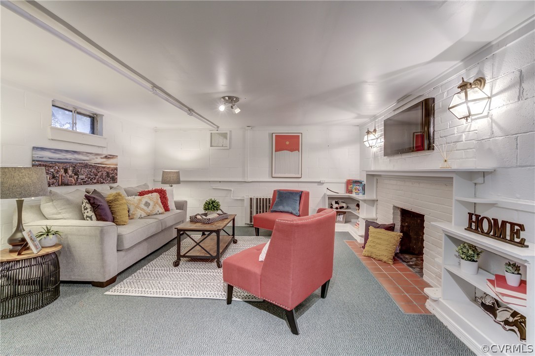 8505 Julian Road Henrico, VA 23229 - Photo 34 of 44 a living room with furniture fireplace and flat screen tv