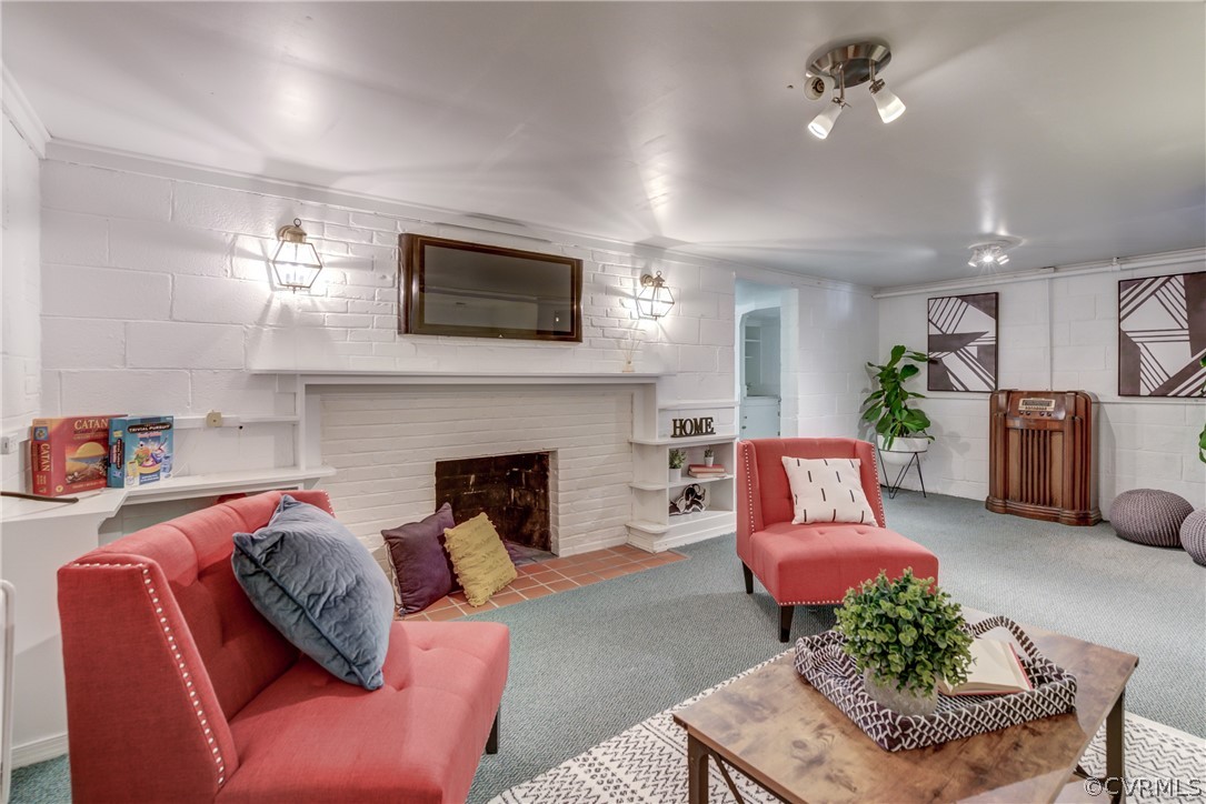 8505 Julian Road Henrico, VA 23229 - Photo 35 of 44 a living room with furniture a fireplace and a flat screen tv