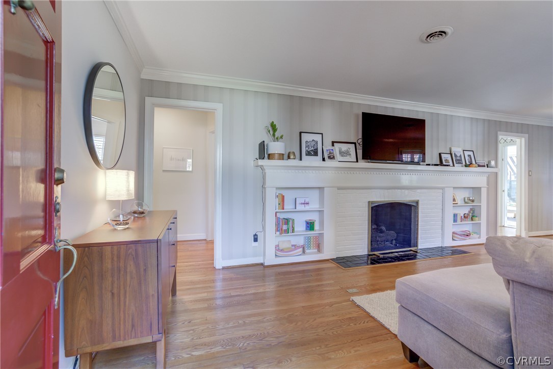 8505 Julian Road Henrico, VA 23229 - Photo 6 of 44 a living room with furniture a fireplace and a flat screen tv