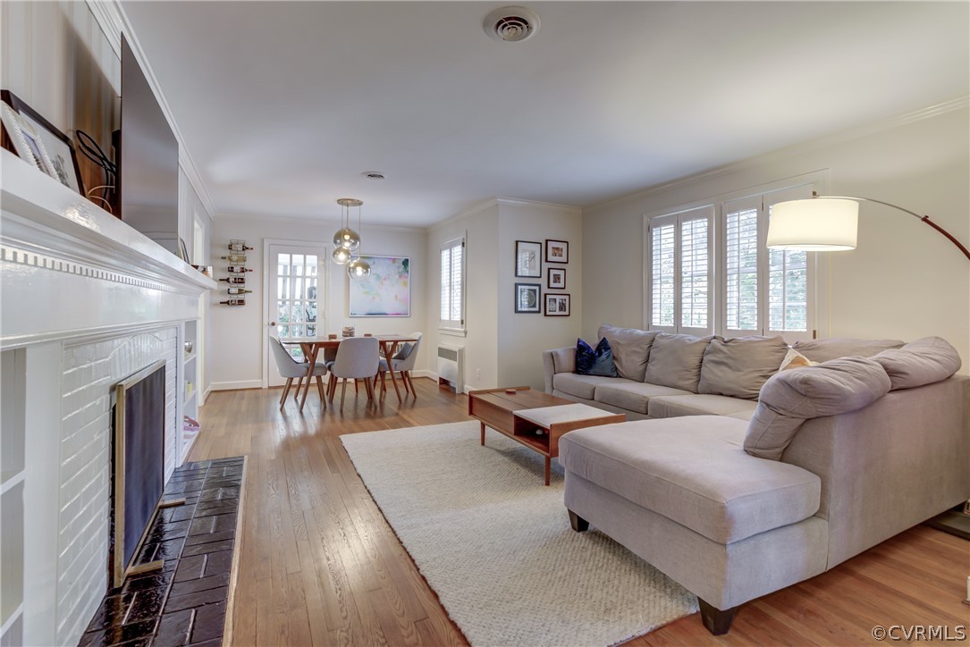 8505 Julian Road Henrico, VA 23229 - Photo 8 of 44 a living room with furniture wooden floor and a fireplace