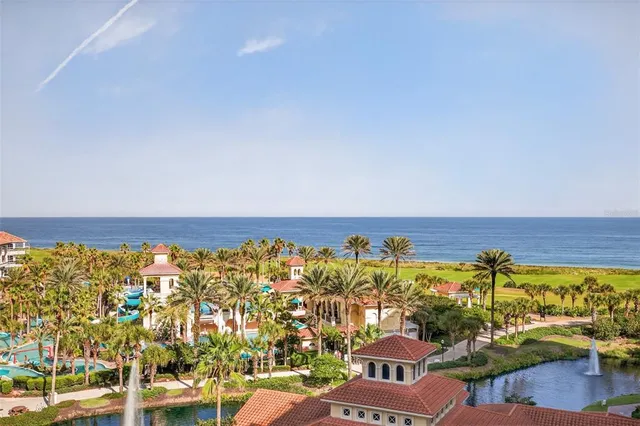 a kitchen with a sink dishwasher a stove a microwave oven with white cabinets