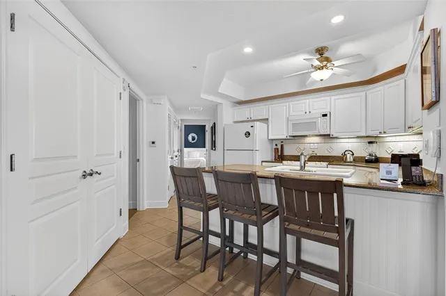 a bedroom with a bed and a large mirror