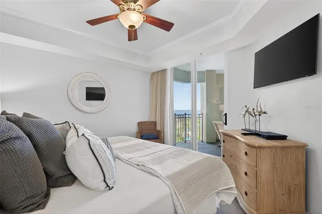 a view of a swimming pool with a table and chairs under an umbrella