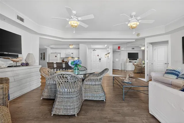a view of a city from a balcony with furniture