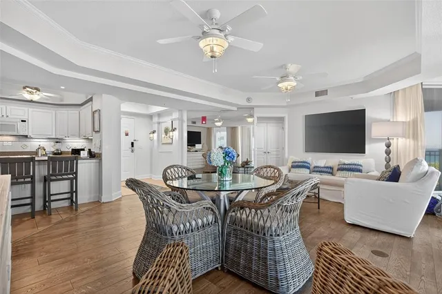a kitchen with a table chairs stove and cabinets