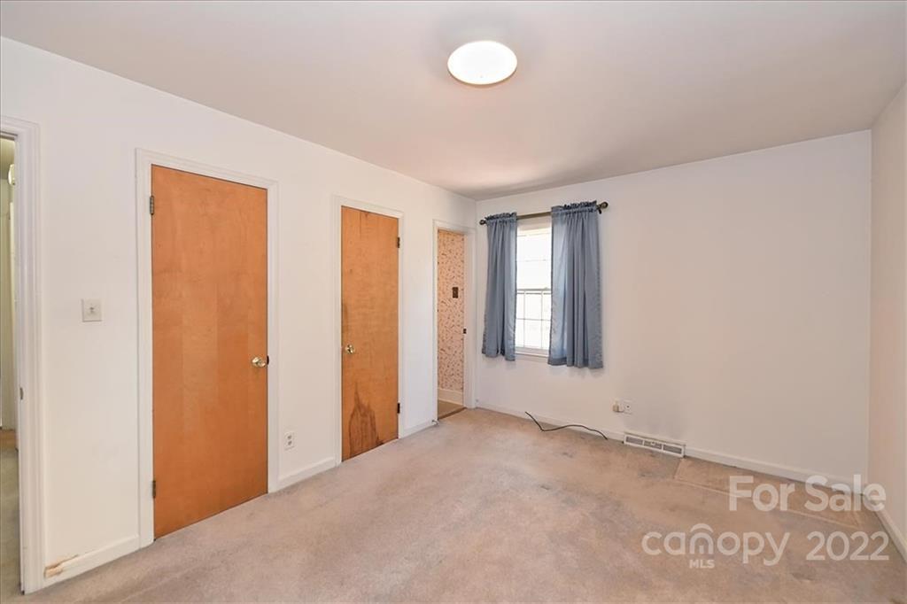 5714 Sharon Road Charlotte, NC 28210 - Photo 14 of 22 an empty room with windows