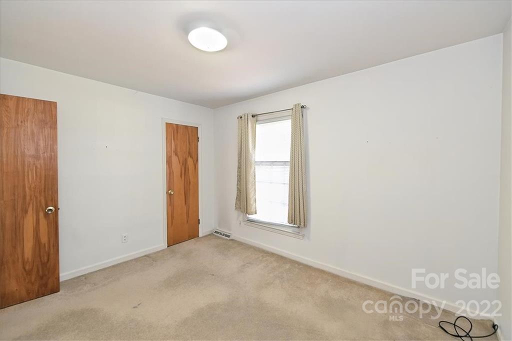 5714 Sharon Road Charlotte, NC 28210 - Photo 16 of 22 an empty room with windows