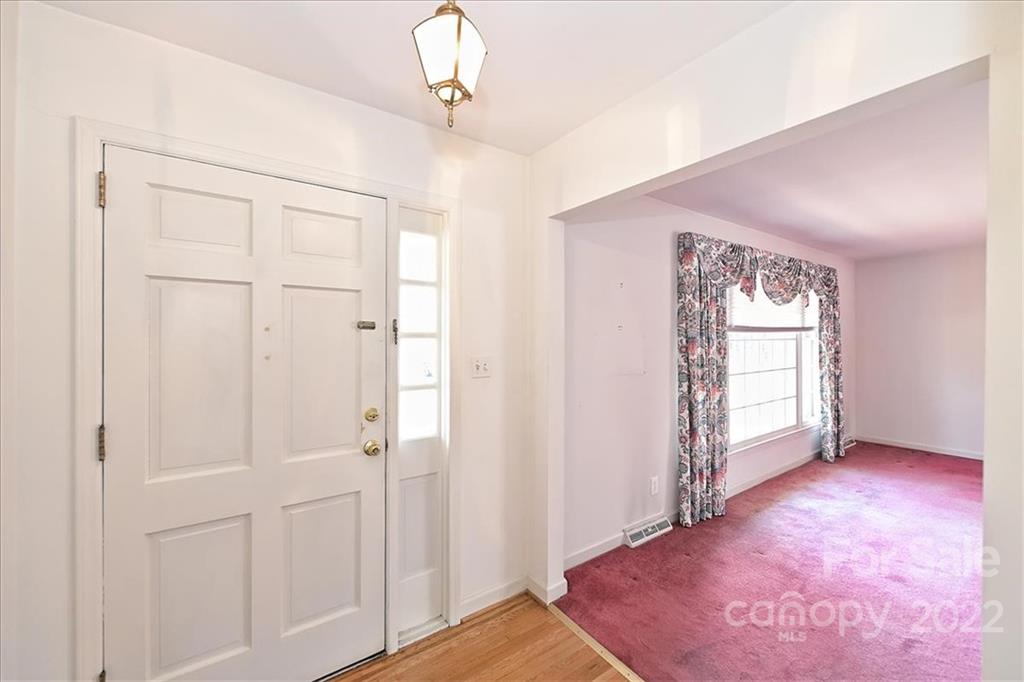5714 Sharon Road Charlotte, NC 28210 - Photo 3 of 22 a view of an empty room with a window