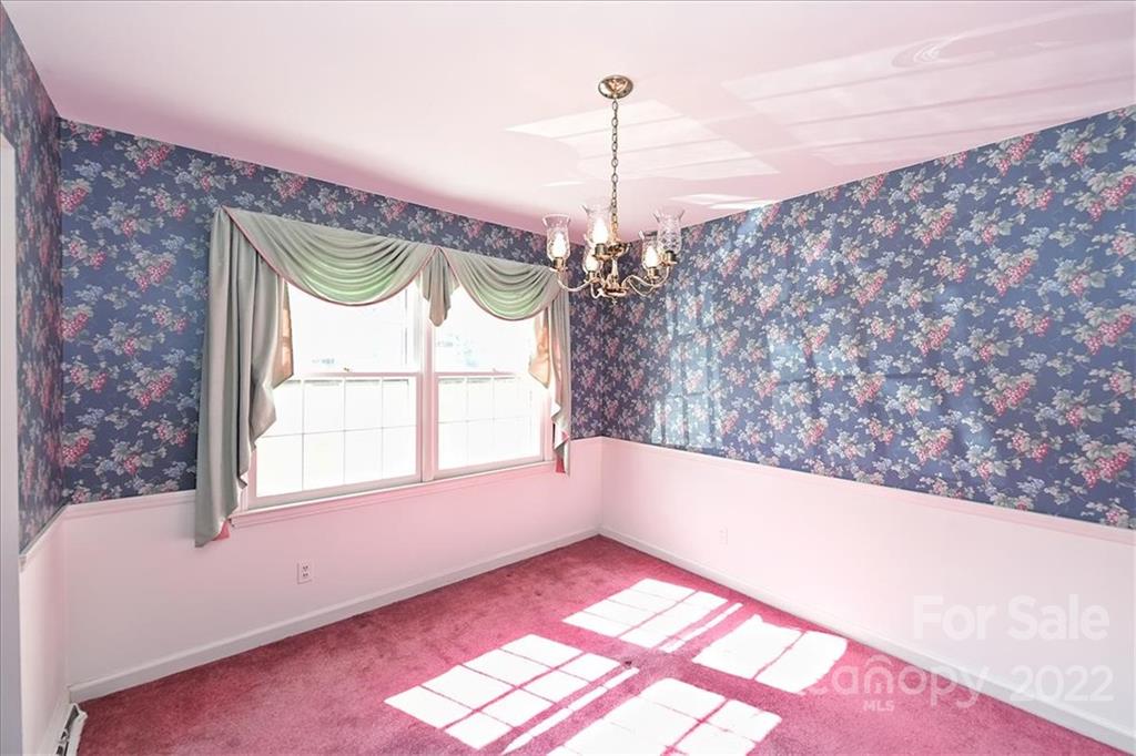 5714 Sharon Road Charlotte, NC 28210 - Photo 5 of 22 a view of a floor & chandelier in a room